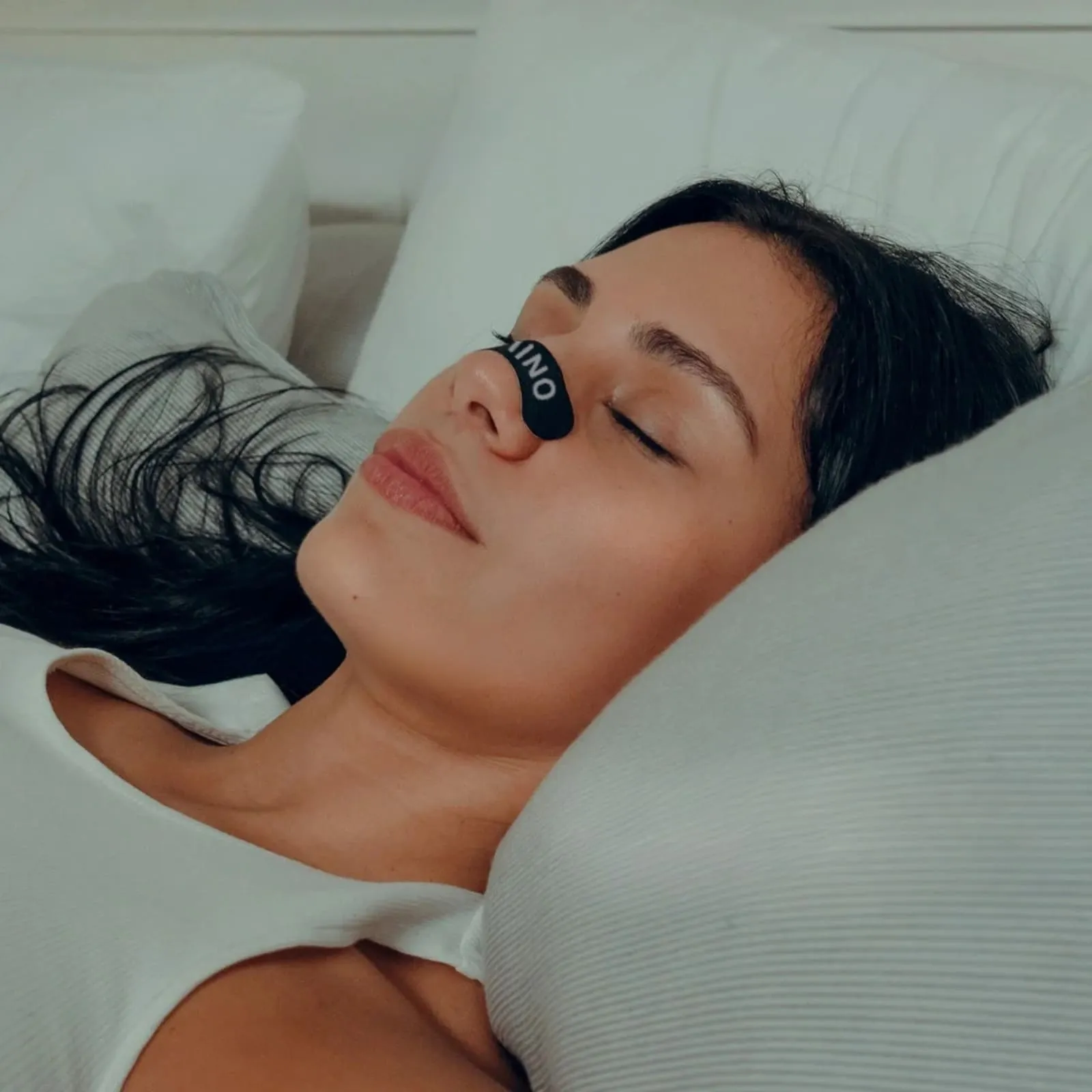 Couple sleeping peacefully with mouth tape supporting nasal breathing