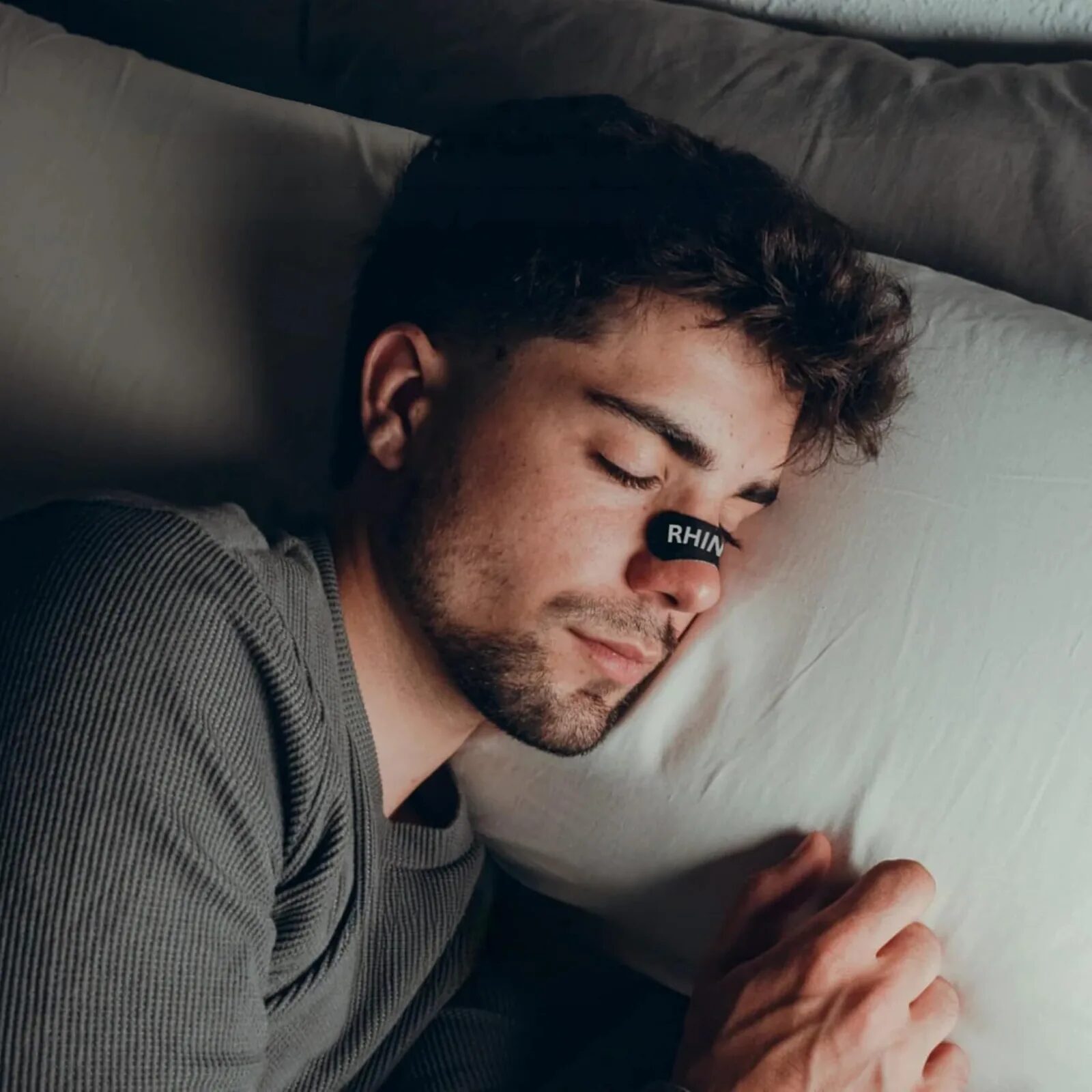 Couple sleeping peacefully — nasal strips and mouth tape for snoring
